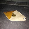 A triangular leather coin purse.