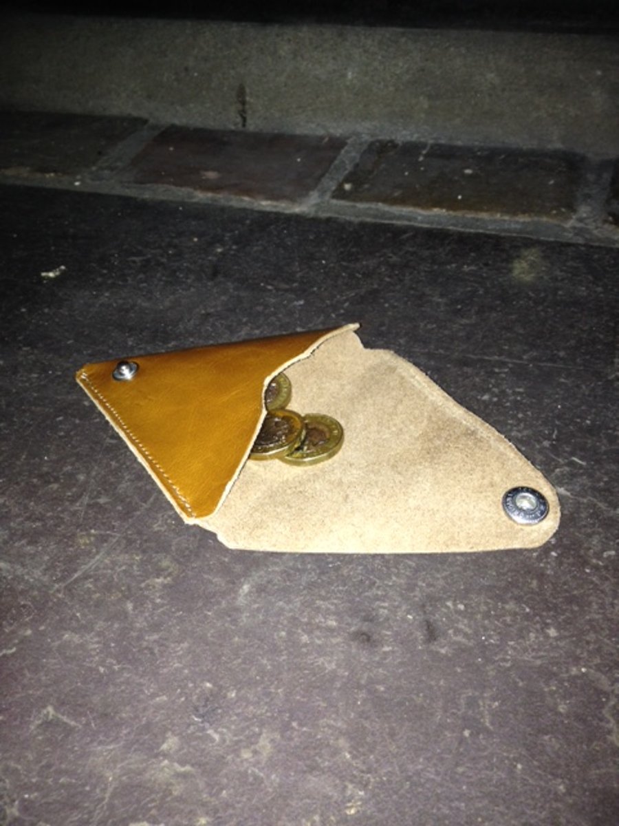 A triangular leather coin purse.
