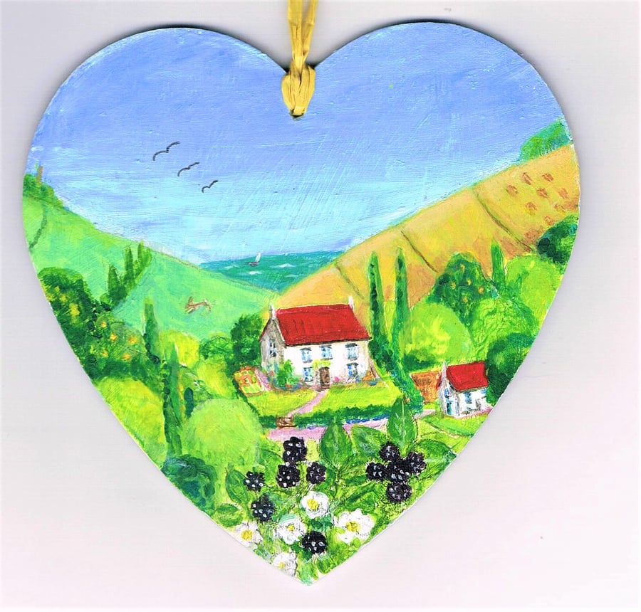 Bramble cottage in Dorset on a wooden heart