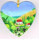Bramble cottage in Dorset on a wooden heart