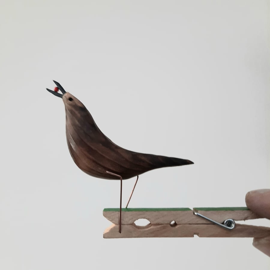 Pecking peg bird