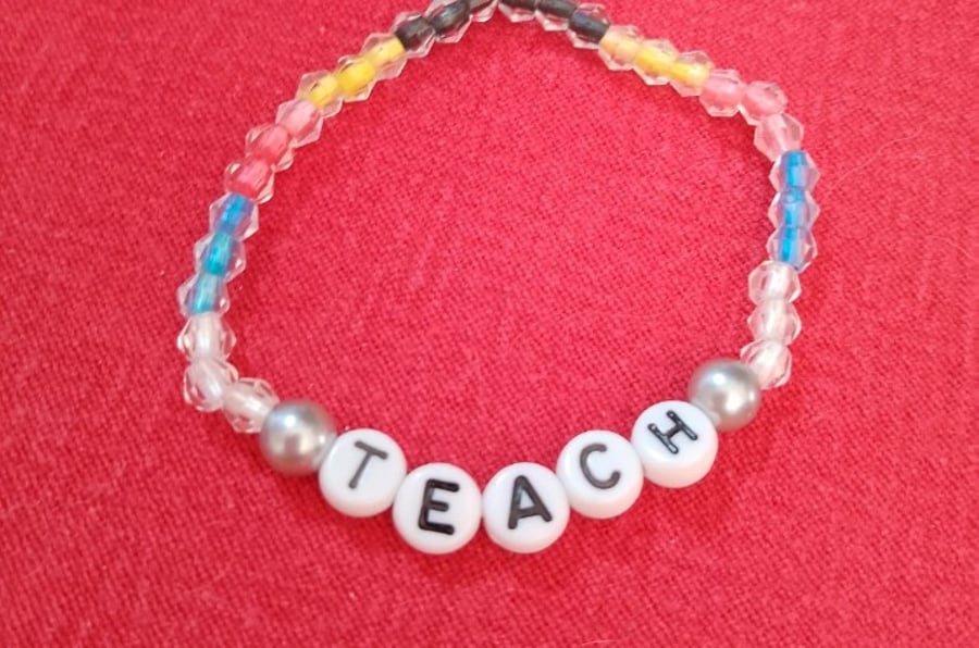 Handmade beaded bracelet with teach in letters.