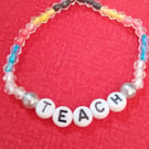 Handmade beaded bracelet with teach in letters.