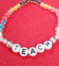 Handmade beaded bracelet with teach in letters. - Image 1