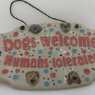 Humorous welcome sign  for dog lovers