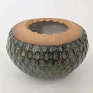 Green glazed stoneware decorative bowl.