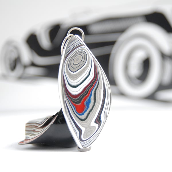 Fordite 'feather ' pendant