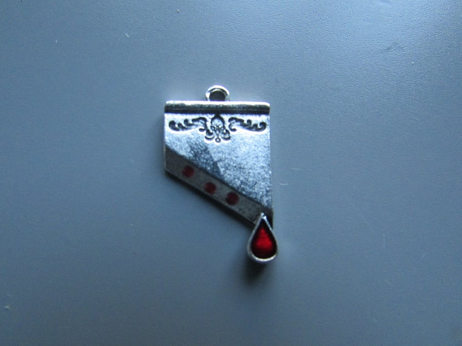 Guillotine Tibetan Charm