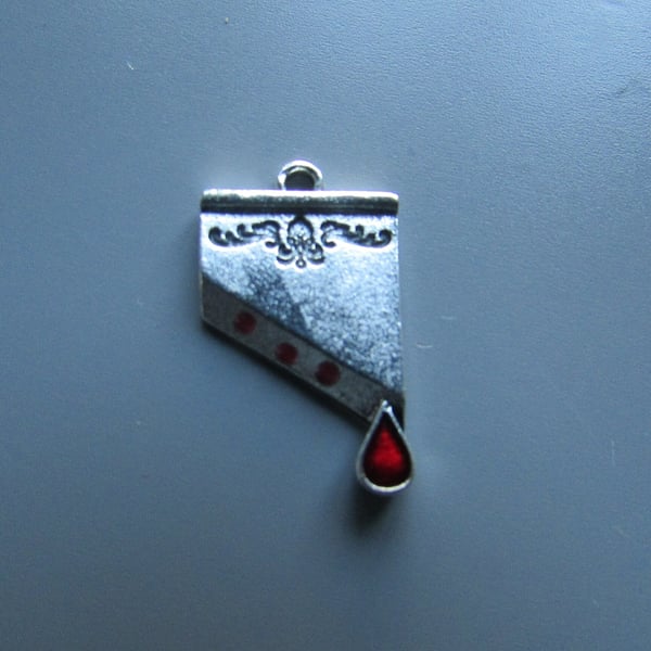 Guillotine Tibetan Charm