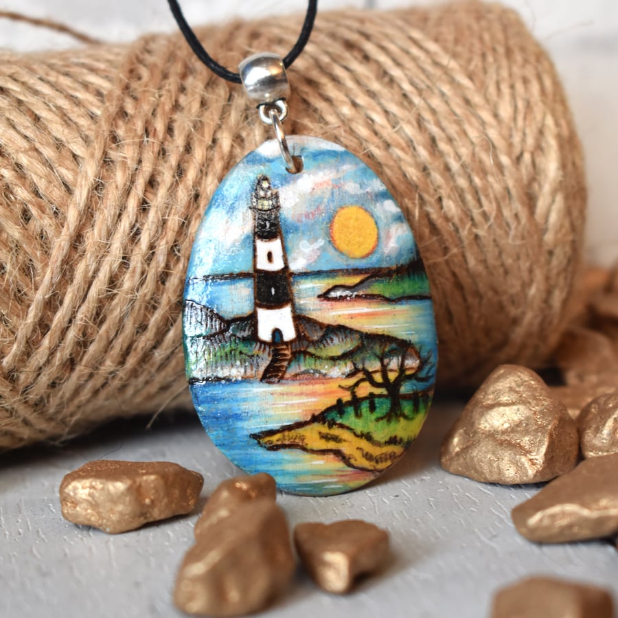 Pyrography lighthouse setting sun wooden pendant.