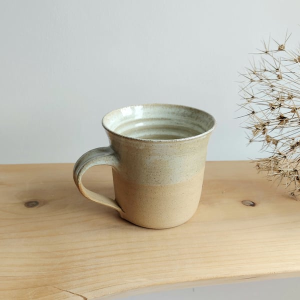 Handmade thrown stoneware pottery mug cream and crystal glaze