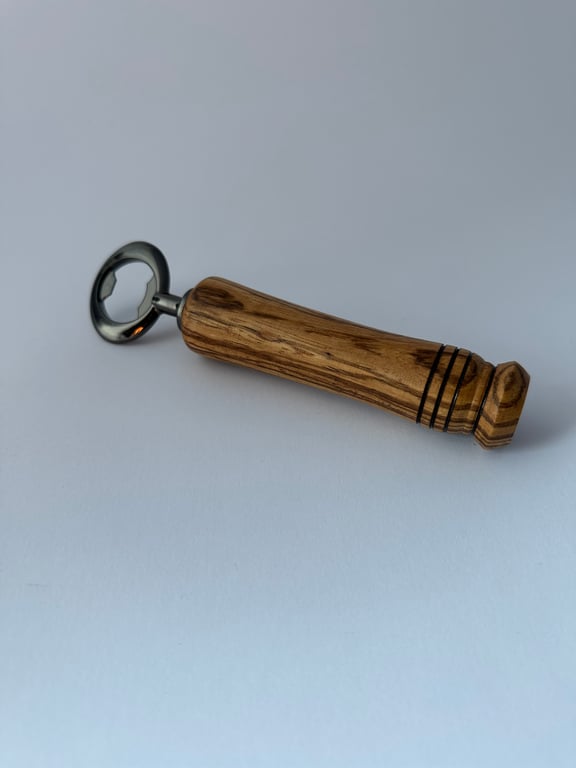 Bottle opener with a Zebrano hardwood handle