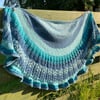 Hand knitted Crescent Lace Shawl in blues