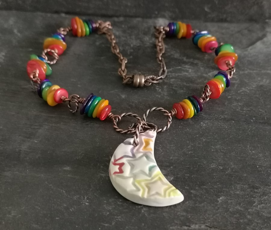 SALE Ceramic moon pendant with star pattern and rainbow shell beads