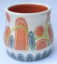 Ceramic hand thrown pot with unique orange and blue decoration - Image 4