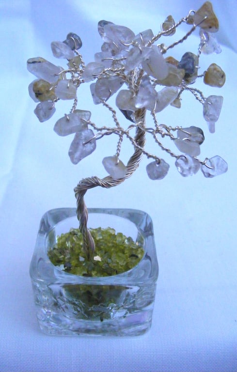 Golden rutilated quartz gemstone tree of life ornament.