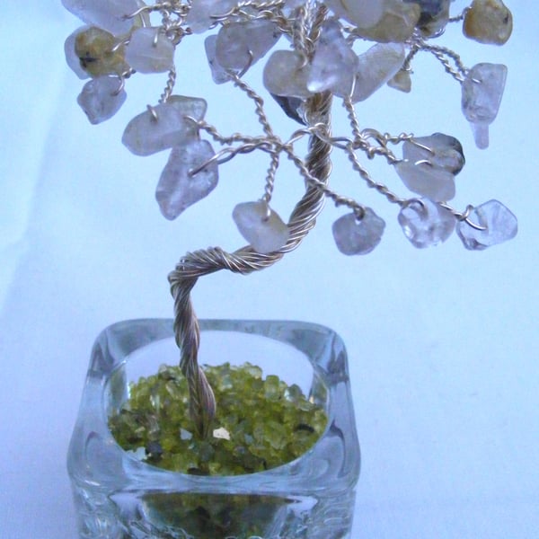 Golden rutilated quartz gemstone tree of life ornament.
