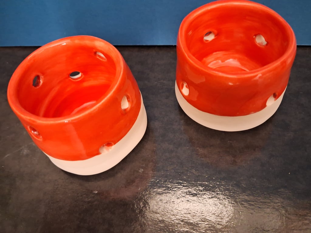 Two unique ceramic hand made tea light holders made with care and above all love