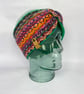 Emerald green and orange knitted fairisle headband