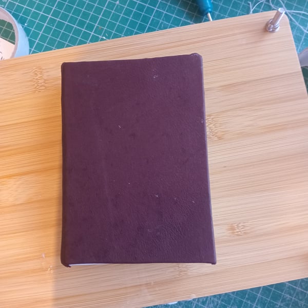 Brown leather small journal or notebook with blank white drawing paper 