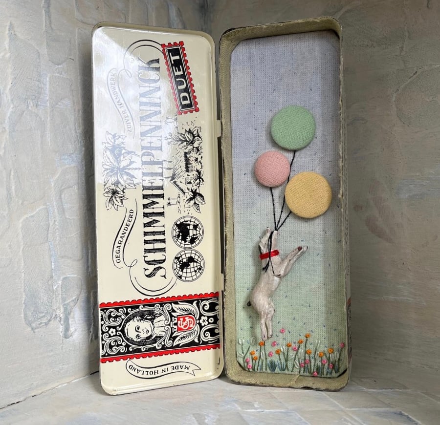 Mixed media art in a vintage tin
