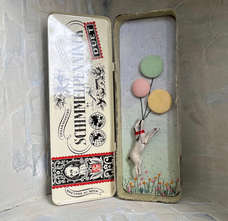 Mixed media art in a vintage tin