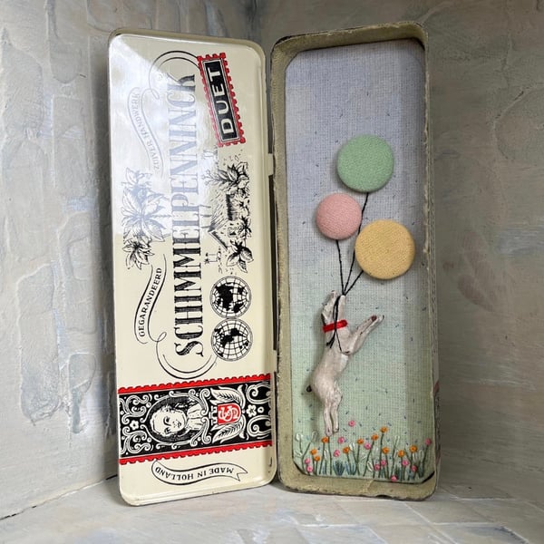 Mixed media art in a vintage tin