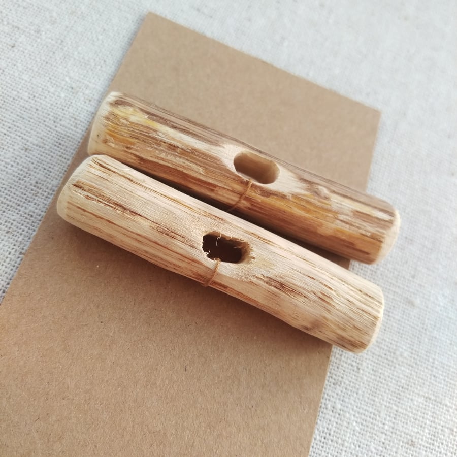 Two large mismatched driftwood toggle buttons with single hole