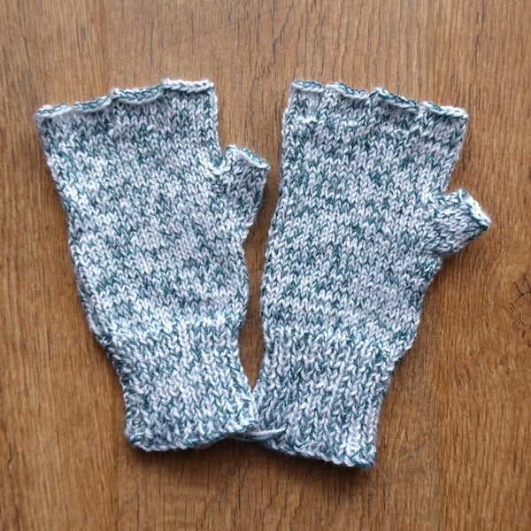 Knitted handmade green and white patterned fingerless gloves