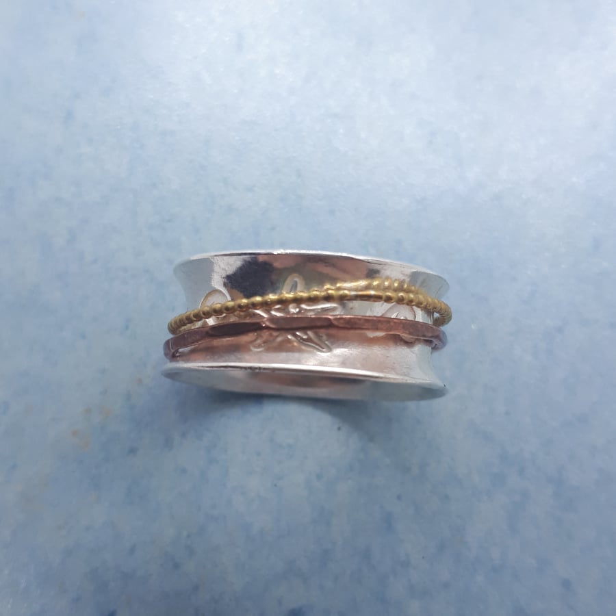 Silver starfish and waves spinner ring
