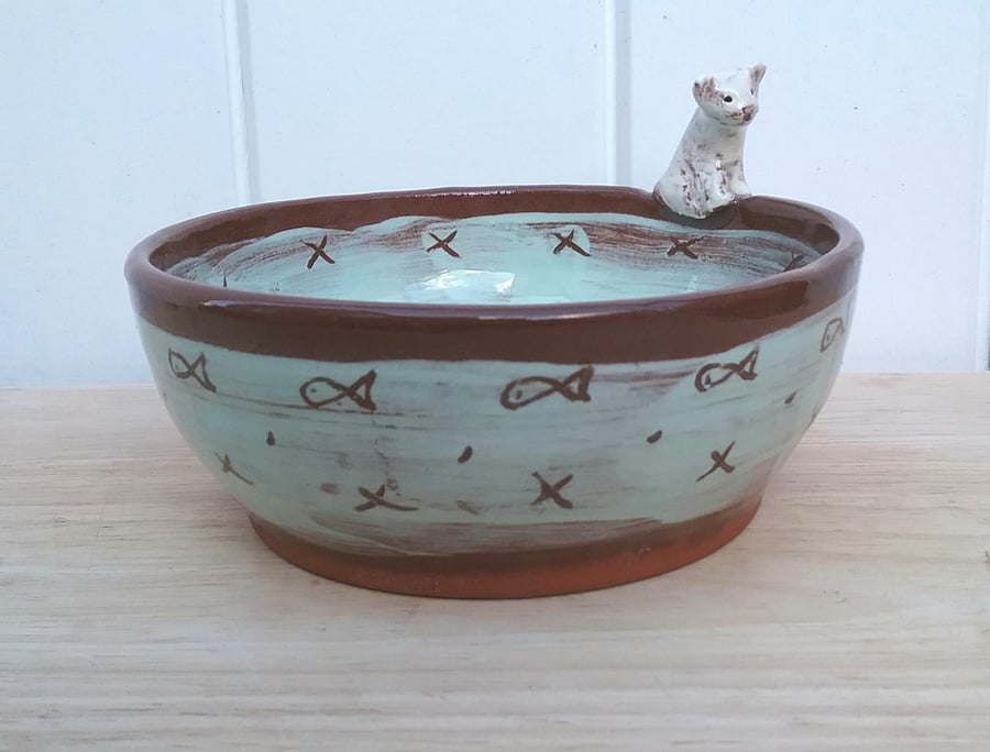 Hand made ceramic cat bowl in turqoise on terracotta clay with white cat figure