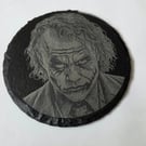 The Joker on a slate coaster 