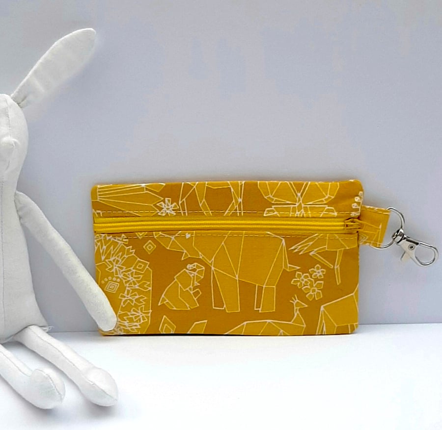 Coin pouch with zip fastening and lobster clasp - mustard - geometric animals