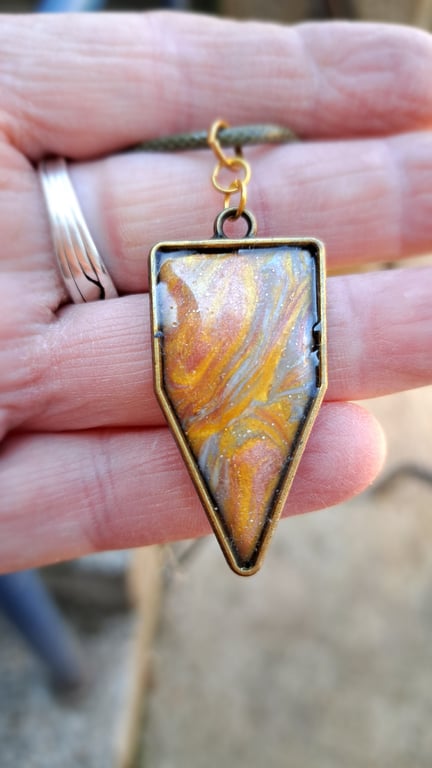 Rope necklace with a polymer clay filled bezel. Gold, rose gold, silver