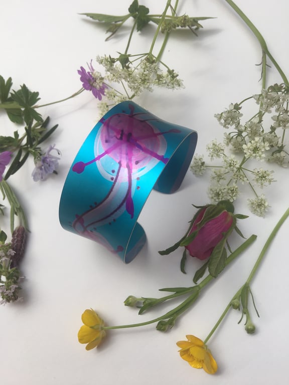 Wide aluminium cuff bangle in turquoise and pinks.
