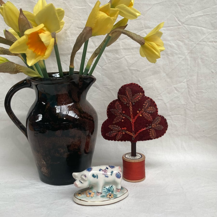 Little plum colours  tree with brown leaves