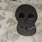 Handmade ceramic black clay skull decoration