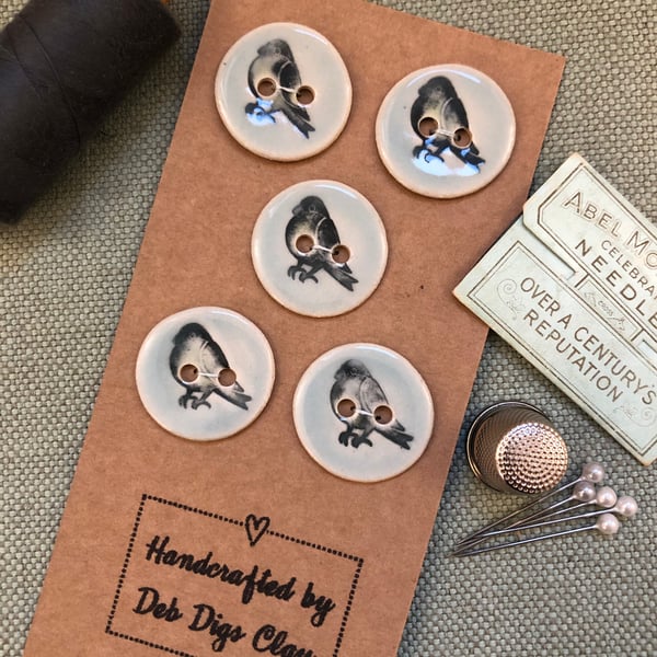 Set of 5 round, pale blue handcrafted ceramic ‘Bird’ buttons