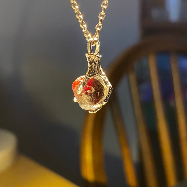 Thames garnet bead claw pendant