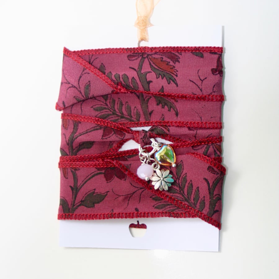 Floral patterned silk ribbon wrap bracelet with flower charm