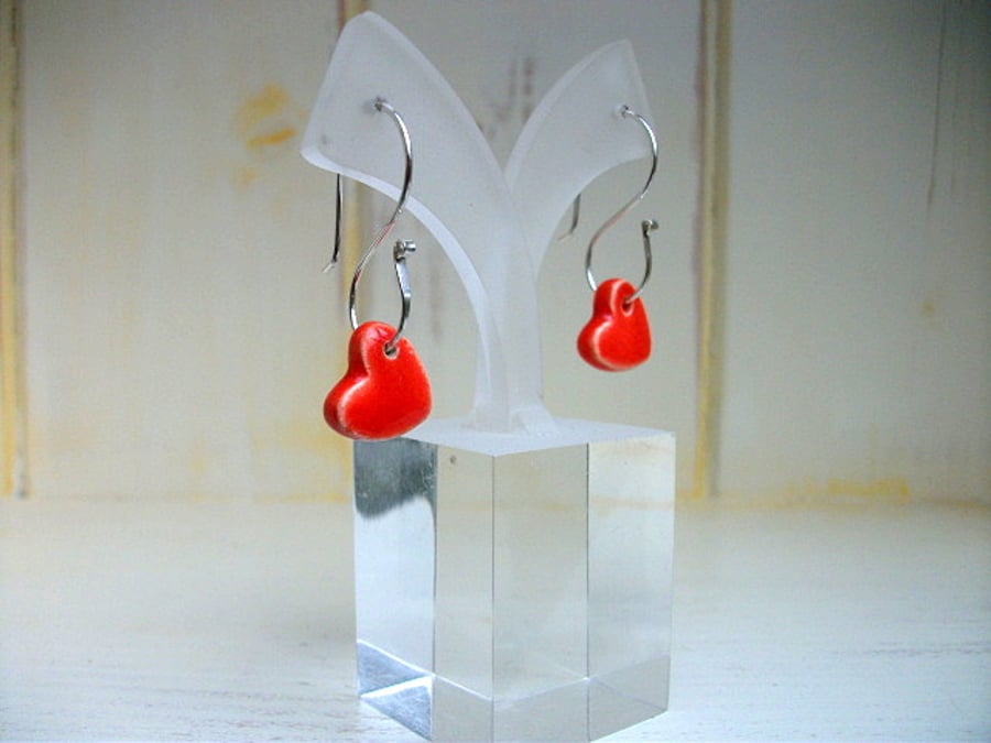 Sunset red ceramic hearts on sterling silver S wire dangle earrings
