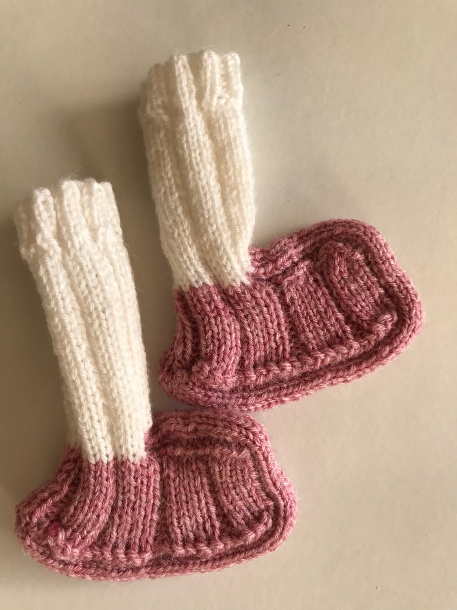 Pink and white hand knitted baby bootees