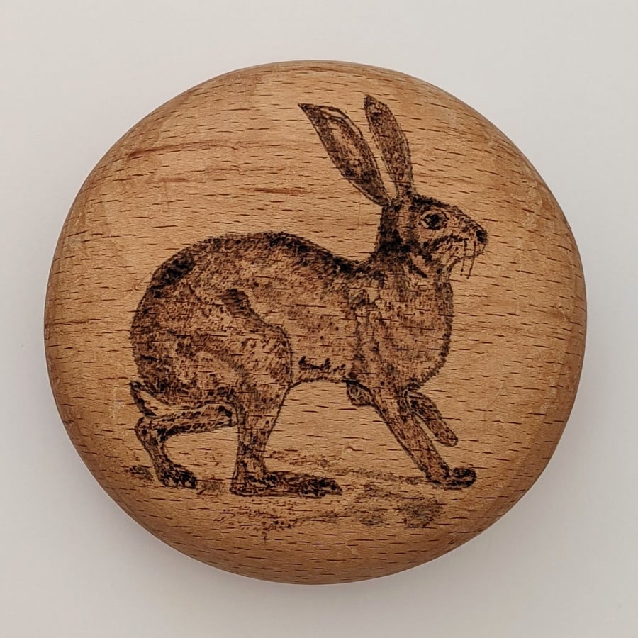 Wood burned hare wooden pebble which can be personalised