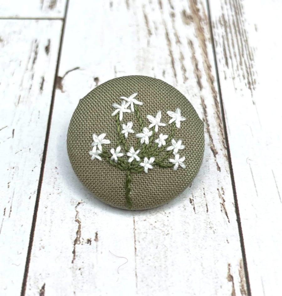 Embroidered flower brooch made from cotton remnant. Zero waste jewellery