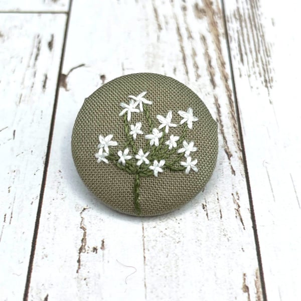 Embroidered flower brooch made from cotton remnant. Zero waste jewellery