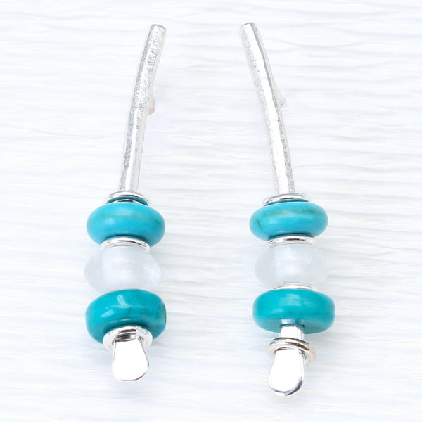 Handmade turquoise and rock crystal earrings on sterling silver rods. Arc, S.