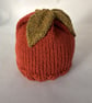 Children's hand knitted beanie with leaf decoration