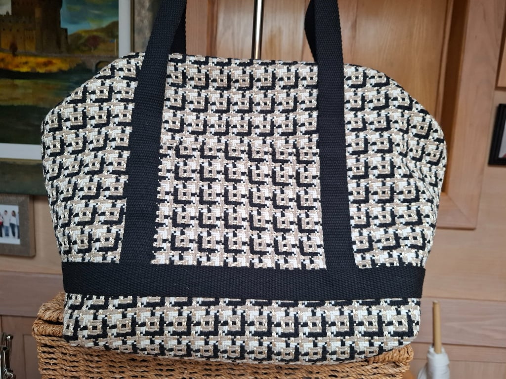 Black and gold carpet bag