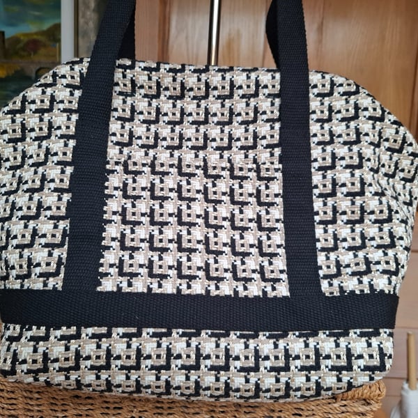 Black and gold carpet bag