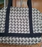 Black and gold carpet bag